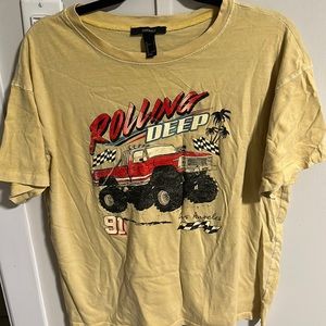 This shirt is from Forever 21. The color well the background color is yellow.
